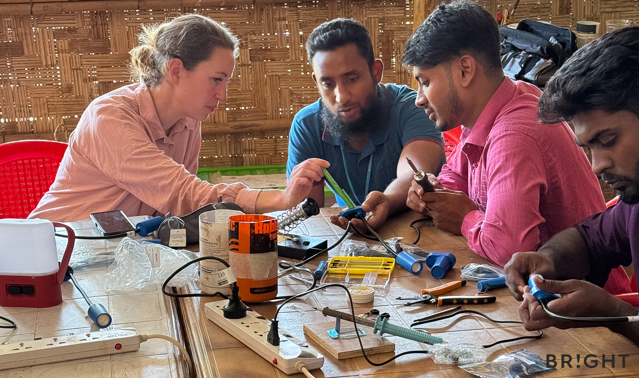 Trainees learn SunBell solar lamp component functions as BRIGHT’s Head of Sales and Partnerships explains repair steps