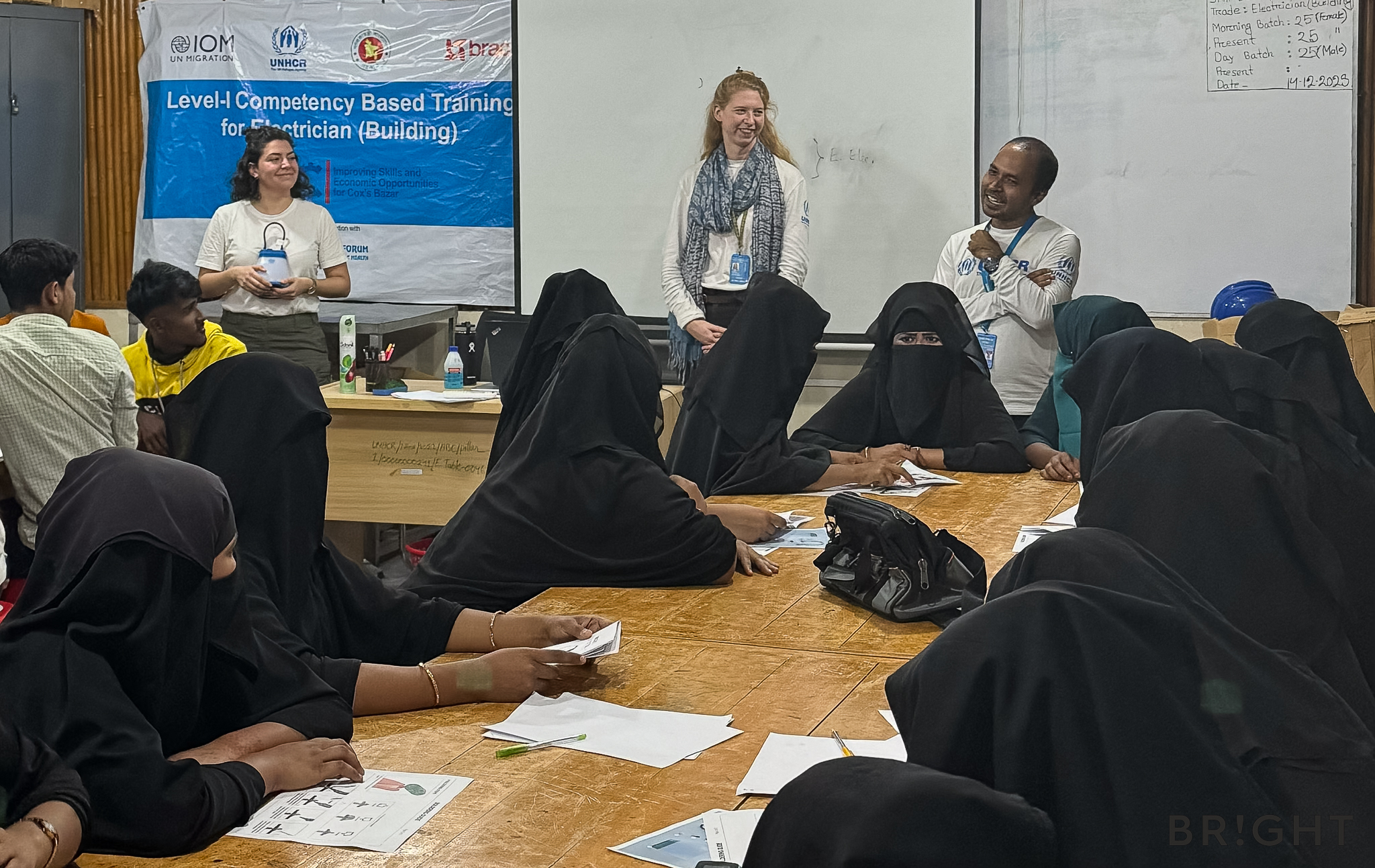 Community members take part in a UNHCR and IOM Bangladesh-supported training on repairing BRIGHT solar lamps in Cox’s Bazar.