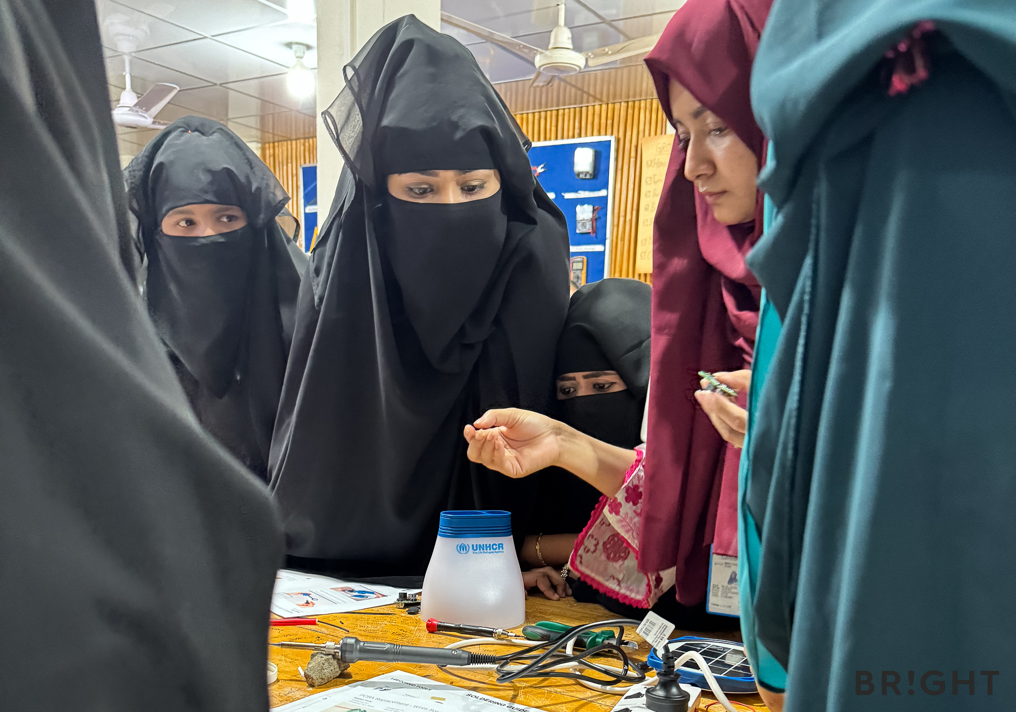 Repair trainees learn how to fix solar lamp PCBs as part of BRIGHT’s humanitarian e-waste programme.